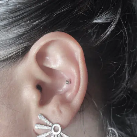 Conch ear piercing, done at Blesink Tattoo Porto
