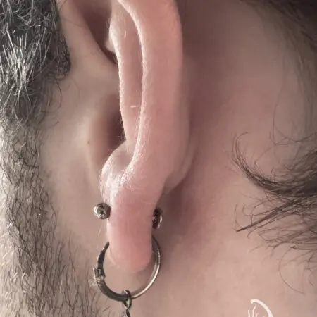 Earlobe piercing, done at Blesink Tattoo Porto