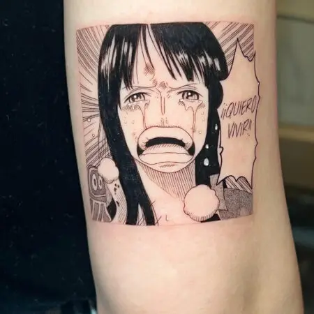 Black and grey anime tattoo on the arm, done at Blesink Tattoo Porto