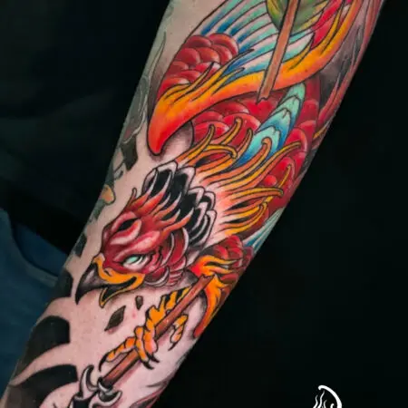 Neo-traditional full color phoenix tattoo on the arm, done at Blesink Tattoo Porto