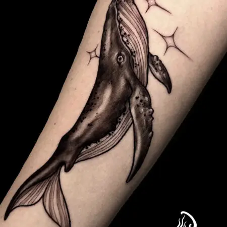 Blackwork whale tattoo on the leg, done at Blesink Tattoo Porto